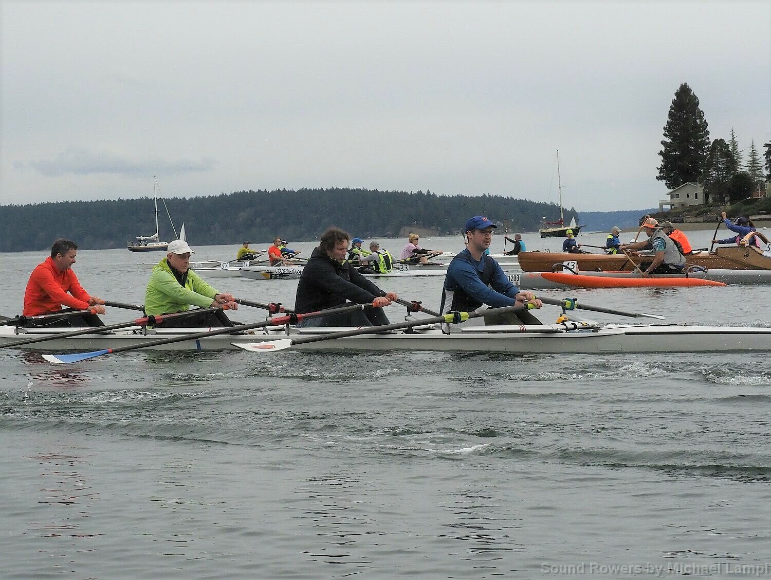 Jeff Bernard, Rainer Storb, Adrian Storb, Kelton Jenkins paddle in the second annual Squaxin Island Race was held Saturday, April 15, by the Sound Rowers and Paddlers Club.